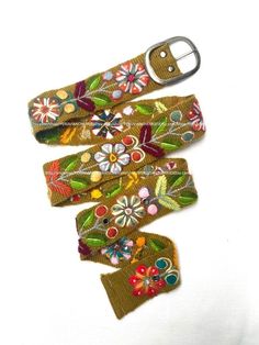 "Hand embroidered belt floral colorful peruvian embroidered belts floral ethnic belt boho belt wool, gifts for her floral ethnic belt peru Size & Fit, available Sizes: All belts Width are or centimeters approximately  Width: 4.5centimeters or 2inches. Size: XS Length to first hole from buckle: 32.3 inches or 82 centimeters approximately Length to last hole from buckle: 23 inches or 59 centimeters approximately Total Length: 35.5 inches or 90 centimeters approximately Size: SMALL Length to first Multicolor Bohemian Belt For Festivals, Folk Style Multicolor Fabric Belt, Folk Style Multicolor Embroidered Belt, Multicolor Fabric Belt In Folk Style, Folk Multicolor Embroidered Belt, Multicolor Folk Fabric Belt, Artisan Multicolor Fabric Belt, Bohemian Multicolor Embroidery Belts For Festival, Bohemian Fabric Belt For Festivals