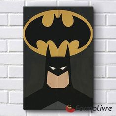 a batman poster hanging on the wall next to a white brick wall with a black background