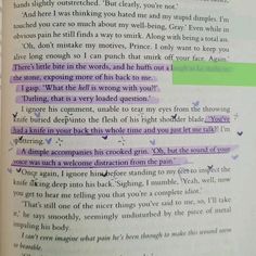 an open book with green and purple lines on it's page, which is highlighted in the bottom right corner