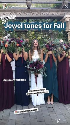 a group of women standing next to each other in front of a sign that says jewel tones for fall