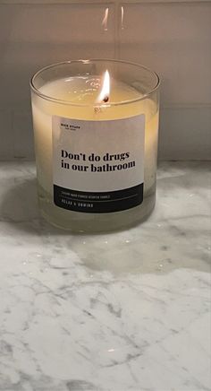 a candle sitting on top of a marble counter