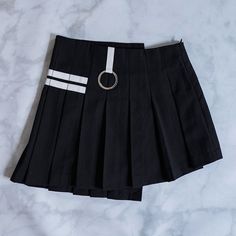 The skirt features cute stacking varsity stripes and an asymmetrical overlapping design. Like all our favorite skirts, we've sewed hidden shorts right into it. Overlapping Design, Wardrobe Revamp, Accessories Fabric, Bra Sizes, Cheer Skirts, Pleated Skirt, Unique Pieces, Fitness Models, Stripes