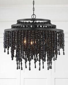 a black chandelier hanging from the ceiling