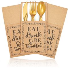 three napkins with gold forks and spoons on top of each other in front of a white background