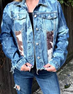 A little bit of country. A little bit of bling. This jacket can take you everywhere and anywhere. Jacket is repurposed and distressed. The horse on back is painted with fabric paint and front and back have faux pony hide pieces accented with rhinestone rivets. Great gift for that special person or that special you. Size XL. Western Style Denim Blue Jacket For Fall, Bohemian Distressed Denim Jacket, Reworked Medium Wash Denim Jacket For Fall, Fall Reworked Medium Wash Denim Jacket, Fall Americana Denim Jacket, Fall Americana Style Denim Jacket, Distressed Denim Jacket For Festival, Distressed Denim Jacket For Fall Festival, Altered Clothes