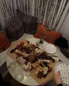 a table topped with lots of different types of cheese and crackers on top of it