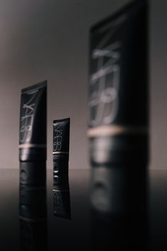 the packaging for nars cosmetics is shown next to it's tube and container