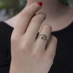 a woman's hand with a ring on it