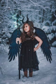 "ALL HALLOWEEN ORDERS MUST BE PLACED BY OCTOBER 18TH Luxurious Young Maleficent costume includes HORNS WING STAFF DRESS girls sz 4-10/12 please note dress size 2t-5 will come with 23\" wings and size 6-12 will come with 34 inch wings. THE HORNS 3Dprint ultra lightweight attached to a plastic headband 7.5 inch curve WINGS Made from lightweight foam NO REAL feathers were used in construction of these wings. The texture of the feathers is printed on to the foam wings to give an illusion of real fea Young Maleficent Costume, Maleficent Costume Kids, Foam Wings, Young Maleficent, Maleficent Wings, Maleficent Costume, Wings Black, Kids Costumes Girls, Queen Costume