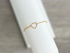 This beautiful 14K gold filled floating heart charm bracelet is adjustable and fits up to an 8" wrist. Bracelet slides to open and secure.  Layer it with any of our gold filled bracelets to create your own personalized stack.  Each bracelet is sold separately* 🤍 14K Gold filled, hypoallergenic; (lead and nickel free)  🤍  NOTE:  Color may vary slightly than picture due to different display devices and settings.   👇🏻 👇🏻 👇🏻 📦📫FREE SHIPPING ON ALL DOMESTIC ORDERS OF $35 OR MORE! 📌CARE:  🤍Keep bracelet in a dry place and away from soaps, chemicals, lotions & sweat. 🤍 Take off your jewelry before sleeping or exercise to avoid any wear and tear. 🤍Gently polish with a soft, lint-free cloth after wearing. Store in a sealed bag or box in a cool, dry place. 📌RETURNS: We accept returns Delicate Adjustable Heart Bracelet For Anniversary, Adjustable Gold Heart Bracelet For Everyday, Gold Adjustable Heart Bracelet For Mother's Day, Mother's Day Gold Adjustable Heart Bracelet, Delicate Adjustable Bracelets For Valentine's Day, Delicate Adjustable Bracelet For Valentine's Day, Adjustable Open Heart Bracelets For Anniversary, Adjustable Delicate Heart Bracelet, Gold Minimalist Adjustable Heart Bracelet