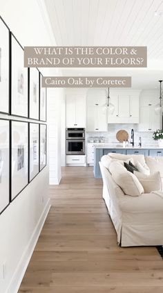 a living room filled with white furniture and pictures on the wall above it's couch