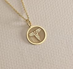 14K Real Solid Gold Medic Disc Pendant ● Material of pendant: Solid Gold 14k ( REAL GOLD ) ● Metal Stamp: 14L ( REAL GOLD ) ● The pendant is available in 6 sizes: - 14,0 mm / 0,55 inches ( Diameter ) In the photos - 15,3 mm / 0.60 inches ( Diameter ) - 16,5 mm / 0,65 inches ( Diameter ) - 19,1 mm / 0,75 inches ( Diameter ) - 21 mm / 0,82 inches ( Diameter ) - 23 mm / 0.90 inches ( Diameter ) ( In the photos the size is 14mm / 0.55 inches Diameter ) ( Jump Ring inner diameter: 4 mm ) ● Material O Yellow Gold Hallmarked Fine Jewelry Necklace, Custom White Gold Necklace With Round Pendant, Custom 14k White Gold Round Pendant Necklace, Custom Yellow Gold Sterling Silver Round Pendant, Yellow Gold Custom Necklace With Tarnish Resistant Round Pendant, Yellow Gold Recycled Gold Medallion Jewelry, Recycled Yellow Gold Medallion Jewelry, Yellow Gold Medallion Jewelry In Recycled Gold, Tarnish Resistant Yellow Gold Round Pendant Necklace