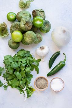 the ingredients are laid out on the table to be used in this recipe, including peppers, onions, and green beans