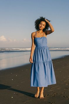 This floaty-feminine dress will be the favourite new staple in your summer wardrobe. Cut from breezy linen-cotton with a double-layered bodice, it features a tiered skirt with eye-catching back detailing and slim ties. Perfect for sun-kissed skin – wear yours with statement heels or chic flats. ⌵ Sizing Choose the size that best matches your body measurements on our size chart. This dress will adjust to you comfortably with its adjustable shoulder and back ties and elasticated waist-back. Our mo Cornflower Blue Dress, Statement Heels, Chic Flats, Slim Tie, Feminine Dress, Blue Midi Dress, Cornflower Blue, Tiered Skirt, Sun Kissed