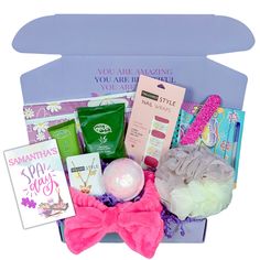 a gift box filled with beauty products and personal care items, including an eye mask