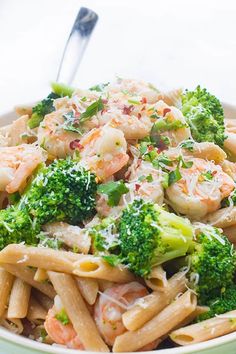 pasta with shrimp and broccoli in a bowl