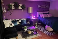 a living room filled with furniture and purple walls