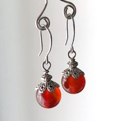 "6682 Carnelian Earrings red orange natural stone dangle drops simple modern classic everyday casual birthday anniversary Valentine's day Mother's day Christmas stuffing stockings holiday gift for her women mom sister wife girlfriend daughter niece aunt grandma cousin colleague best friend. Enjoy the beauty & power of natural gemstones. MATERIALS & DIMENSIONS ✦ Natural CARNELIAN, orange red, smooth round beads 10mm; ✦ SILVER plated bead caps, spacers, pins and fish hook ear wires; ✦ The total le Carnelian Teardrop Earrings For Gift, Red Carnelian Earrings, Red Carnelian Earrings Perfect As A Gift, Nickel-free Red Carnelian Earrings, Round Carnelian Earrings, Red Carnelian Earrings With Ear Wire, Orange Carnelian Earrings For Gift, Red Carnelian Teardrop Earrings, Christmas Stuffing