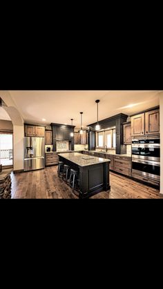 an image of a large kitchen with wooden floors