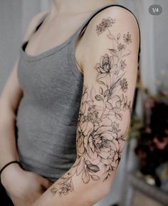 a woman with a flower tattoo on her arm