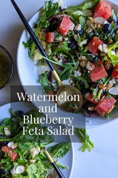 watermelon and blueberry feta salad on two white plates with black chopsticks