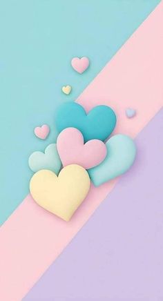 some hearts are floating in the air on a pink and blue background