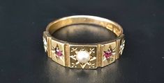 A gorgeous antique late Victorian 15ct gold ring.  Central seed pearl with alternate seed pearls and rubies. The band is stamped to show that it was assayed in Birmingham, dating to 1901 and made by henry Hyde & Sons.  The ring measures between L1/2 and M on the ring sizer. The ring is in lovely antique condition with normal surface wear commensurate with its age.  💐Buy as much as you like for only one shipping charge we don't charge extra for any additional item💐 Please look at all photograph Victorian Rings Vintage, Antique Ruby Ring, Etsy Gold Ring, Victorian Rings, Ring Sizer, Seed Pearl, Multi Stone Ring, Ear Jewelry, Antique Rings