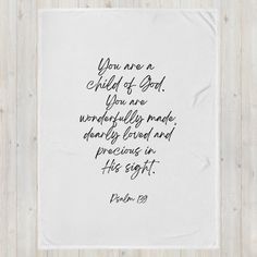 a white towel with the words you are a child of god and an image of a handwritten poem on it