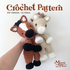 two crocheted stuffed animals sitting next to each other in front of a white background