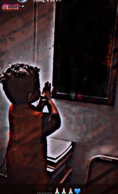 a blurry image of a child taking a selfie in front of a mirror