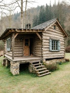 a log cabin with steps leading up to it