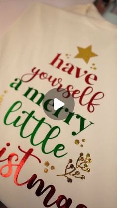 a white t - shirt with the words have yourself merry little christmas written on it