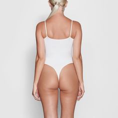 Fits Everybody Cami Bodysuit | Marble — With its wide scoop neckline and low back providing the perfect foundation under clothing, this Cami Bodysuit is an essential wardrobe foundation. Features a high cut leg opening and thong back that remains invisible under clothing. High Cut Solid Leotard With Lined Body, High Cut Leotard With Built-in Bra, Solid High Cut Lined Bodysuit, High Cut Smoothing Bodysuit, Sleek High Cut Solid Bodysuit, High Cut High Stretch Bodysuit With Built-in Bra, Stretch Bodysuit With Built-in Bra And High-cut Leg, Seamless Shapewear Bodysuit With High-cut Leg, Solid Color Backless Bodysuit With Minimal Stretch