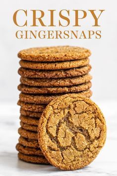 a stack of crispy ginger snaps next to a pile of cookies