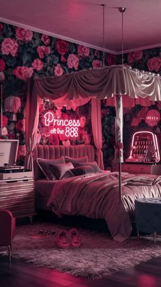 a bedroom decorated in pink and black with flowers on the walls, bedding, dressers, and mirror