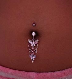 a belly piercing is attached to the side of a woman's stomach