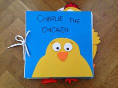 a children's book about charlie the chicken on a wooden floor with string attached to it