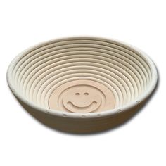 a white bowl with a smiley face on it