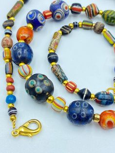 The Beautiful Multi Color Mosaic Glass Beads Necklace From Ancient Roman's Time From Central Asia Some Gold Color Brass Beads Are Used As Spacers In The Necklace Unique Beads For Collections and Studies Multicolor Single Strand Beads For Jewelry Making, Single Strand Glass Beaded Necklaces With Round Beads, Traditional Multicolor Single Strand Beads, Multicolor Single Strand Beads, Artisan Single Strand Multicolor Beads, Artisan Multicolor Single Strand Beads, Vintage Multi-strand Beaded Necklaces With Colorful Beads, Antique Multicolor Beaded Necklace, Antique Handmade Multicolor Beads