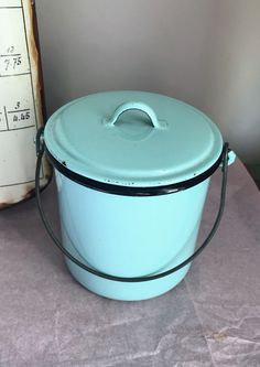 a large blue pot sitting on top of a table