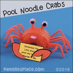 an orange crab with googly eyes holding a sign that says pool noodle crabs