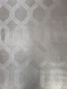 a metallic wallpaper with hexagonal shapes on it's surface, as well as lines and dots