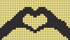 a cross stitch pattern with the shape of a face in black and yellow, on a white background