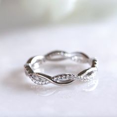 ✩ Made of solid sterling silver. Good for sensitive skin. ✩ Heavy gold plating gives the ring extra shine and durability ✩ Brilliant cut finest CZ stones, sparkle like real diamonds ✩ Ship beautifully packaged ✩ Shank width 3.5 mm ✩ Approx. weight: 1.8g More blings from Joylene: https://www.etsy.com/shop/joylenedesign We only choose the finest diamond simulants (CZ 5A) on the market, with a breathtaking level of brightness like real diamonds. Our jewelry can be found in stores and boutiques in I Elegant Hypoallergenic Cubic Zirconia Rings, Silver Eternity Band With Halo For Promise, Elegant Adjustable Infinity Stackable Rings, Elegant Hypoallergenic Midi Rings For Promise, Modern Twist Infinity Stackable Rings For Anniversary, Elegant Stackable Infinity Rings, Dainty Infinity Stackable Promise Rings, Infinity Stackable Promise Rings, Elegant Infinity Eternity Band As A Gift