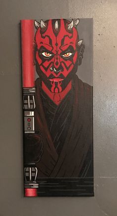 a darth vader star wars notebook with red pen on the front and black cover