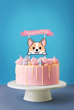 a birthday cake with pink frosting and a dog on top