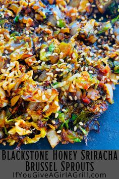 a blue plate topped with broccoli and other vegetables next to text that reads blackstone honey sriraca brussel sprouts