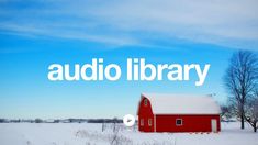 a red barn sitting in the middle of a snow covered field under a blue sky