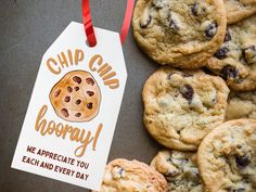 chocolate chip cookies are next to a sign