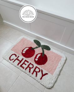 a bathroom rug with cherries on it